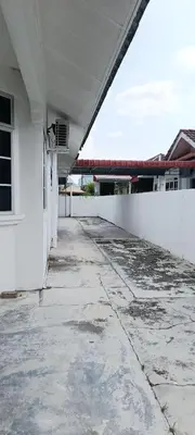 an empty hallway of a white building at Single Storey Bungalow 12 pax in Ipoh
