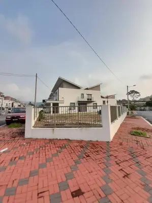 a white house with a brick sidewalk in front of it at Simple Home Taiping \u7b80\u5c45 @ Suria Aman in Kamunting