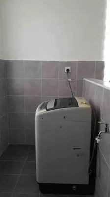 a small refrigerator in a bathroom with a wall at Simple Home Taiping \u7b80\u5c45 @ Suria Aman in Kamunting