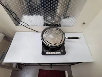 a fan sitting on top of a table at Family Stay at Quintet A2-7-3A in Tanah Rata