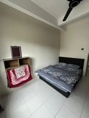 a bedroom with a bed and a ceiling fan at Family Stay at Quintet A2-7-3A in Tanah Rata