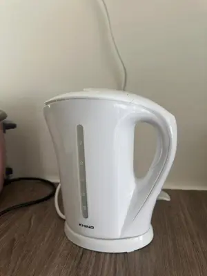 a white toaster sitting on top of a table at Family Stay at Quintet A2-7-3A in Tanah Rata