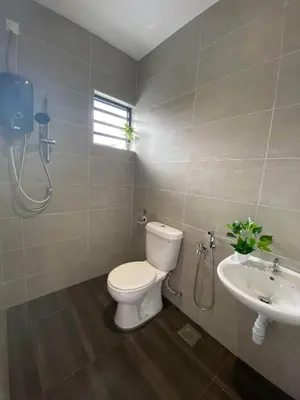 a bathroom with a toilet and a sink at LYL HOMESTAY-IPOH 10Pax 4R in Ipoh