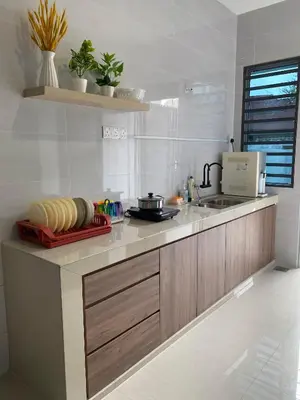 a kitchen with a sink and a counter top at LYL HOMESTAY-IPOH 10Pax 4R in Ipoh