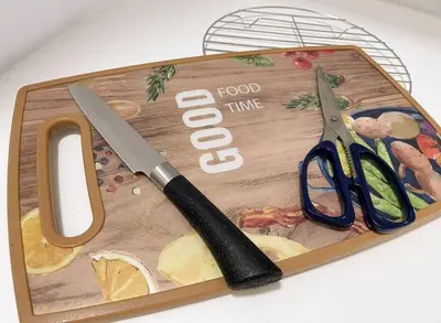 a cutting board with a pair of scissors on it at Beacon Executive Suites #Georgetown #InfinityPool #15 in George Town