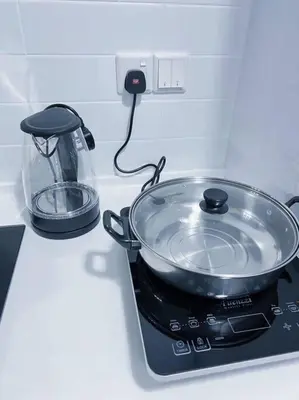 a pot sitting on top of a stove at Beacon Executive Suites #Georgetown #InfinityPool #15 in George Town