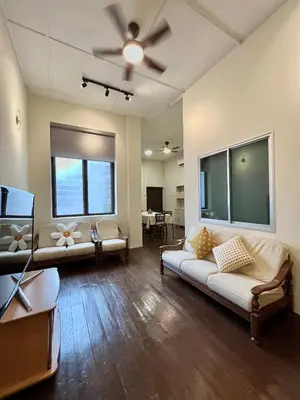 a living room with two couches and a ceiling fan at The Neighbour KKB - Rooms with shared bathroom - Whole unit has 4 rooms in Kuala Kubu Baharu