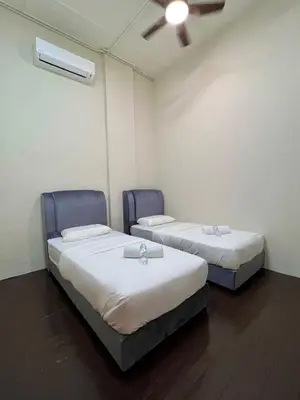 two beds in a small room with a ceiling at The Neighbour KKB - Rooms with shared bathroom - Whole unit has 4 rooms in Kuala Kubu Baharu