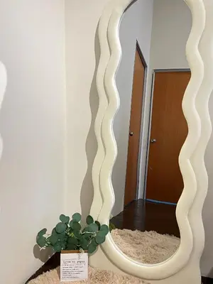 a mirror in a room with a potted plant at The Neighbour KKB - Rooms with shared bathroom - Whole unit has 4 rooms in Kuala Kubu Baharu