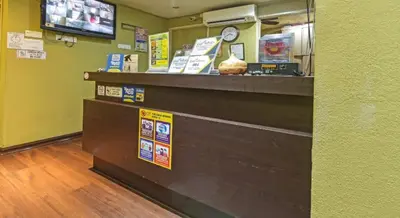 a grocery store with a cash register and a counter at Juru Hotel in Bukit Mertajam