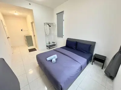a bedroom with a large purple bed in a room at TheSun #BayanLepas#QueensbayMall#PISA#USM in Bayan Lepas