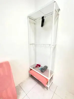 a room with a white shelving unit with a tool at TheSun #BayanLepas#QueensbayMall#PISA#USM in Bayan Lepas