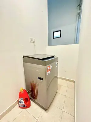 a small appliance in a bathroom with a red vacuum at TheSun #BayanLepas#QueensbayMall#PISA#USM in Bayan Lepas