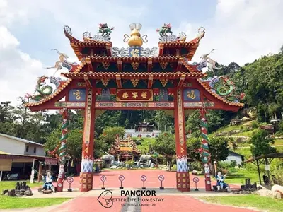 a large gate in a park with a building at Better Life Apartment near beach-2room 2bathroom 6pax in Pangkor