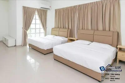a hotel room with two beds and a window at Tanjung Bungah 6BR 20Pax Bungalow w/ Snooker BBQ in Tanjung Bungah