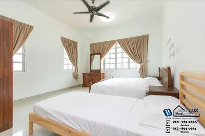 a bedroom with two beds and a ceiling fan at Tanjung Bungah 6BR 20Pax Bungalow w/ Snooker BBQ in Tanjung Bungah