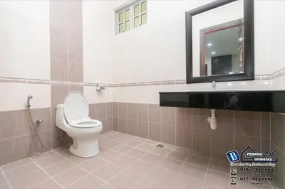 a bathroom with a toilet and a sink and a mirror at Tanjung Bungah 6BR 20Pax Bungalow w/ Snooker BBQ in Tanjung Bungah