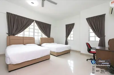 a bedroom with two beds and a chair and windows at Tanjung Bungah 6BR 20Pax Bungalow w/ Snooker BBQ in Tanjung Bungah