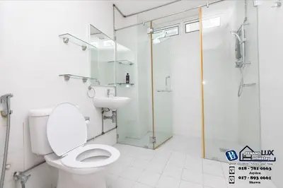a bathroom with a toilet and a glass shower at GeorgeTown 6BR KTV Bungalow 28Pax in George Town