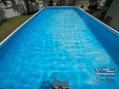 a large pool with blue water in a yard at GeorgeTown 6BR KTV Bungalow 28Pax in George Town