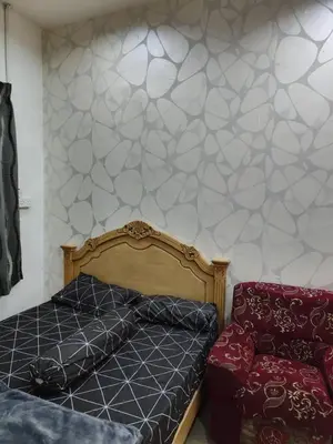 a bedroom with a bed and a couch at YMT Tambun The Lost World Hideaway in Ipoh