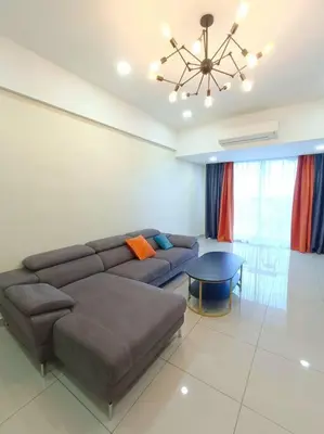 a living room with a couch and a table at Joyful Sitiawan skygarden swimming pool in Seri Manjung