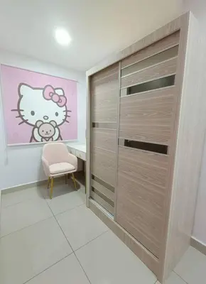 a room with a walk in closet with a chair and a desk at Joyful Sitiawan skygarden swimming pool in Seri Manjung