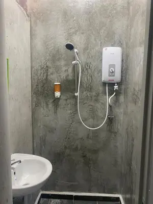 a bathroom with a shower and a sink at SmileHome at Cameron Brinchang - KEA FARM in Brinchang