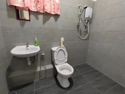 a bathroom with a toilet and a sink at CLP perai homestay near Sri Muniswarar Temple 2 in Perai