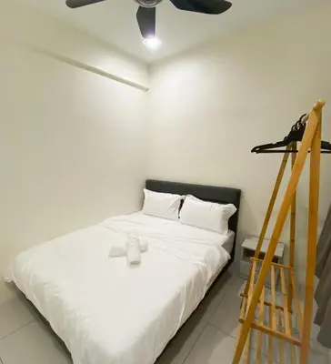 a bedroom with a bed and a ceiling fan at Comfy Suite Manhattan Ipoh PoolView Waterpark Free Netflix&Game in Ipoh