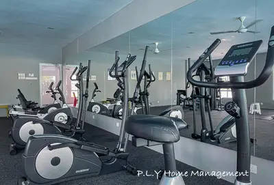 a gym with a bunch of cardio machines in it at Comfy Suite Manhattan Ipoh PoolView Waterpark Free Netflix&Game in Ipoh