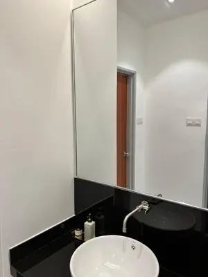 a bathroom with a sink and a large mirror at Inn Homestay 1st Floor Unit in Teluk Intan