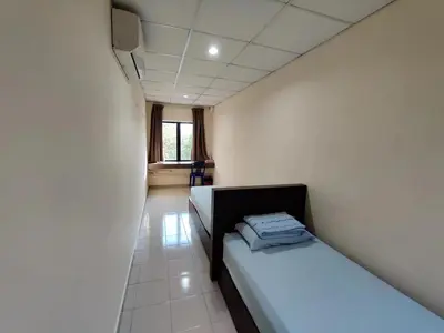 a small room with two beds and a window at CLP perai homstay in perai in Perai