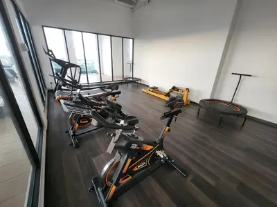 a gym with two exercise bikes in a room at Praicon Executive Suite in Butterworth