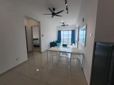 a kitchen and dining room with a table and chairs at Praicon Executive Suite in Butterworth
