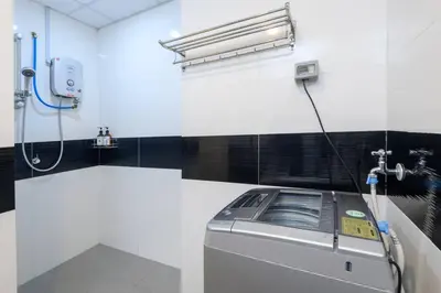 a washing machine in a room with a shower at 2R2B/Harmony Sunrise/1~8pax/Gurney/Mansion One in George Town