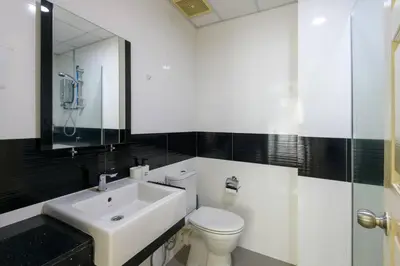 a white bathroom with a sink and a toilet at 2R2B/Harmony Sunrise/1~8pax/Gurney/Mansion One in George Town