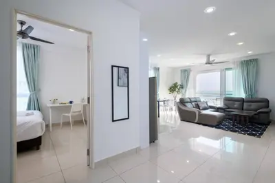 a living room with a couch and a bed in a room at 2R2B/Harmony Sunrise/1~8pax/Gurney/Mansion One in George Town