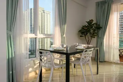 a dining room with a table and chairs and a large window at 2R2B/Harmony Sunrise/1~8pax/Gurney/Mansion One in George Town