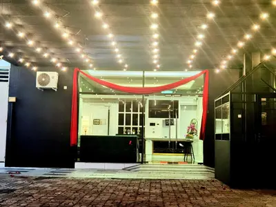a room with a red drape on the wall at 1 Day Car Hotel - BG Perdana in Batu Gajah
