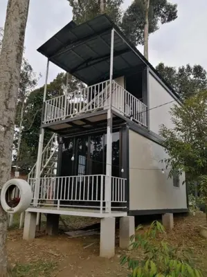 a tree house with a large balcony on display at D'RUMAH BONDA RIVER VIEW Kuala Kangsar in Kampong Senawar